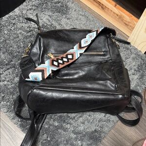 Black Leather Backpack with Patterned Strap